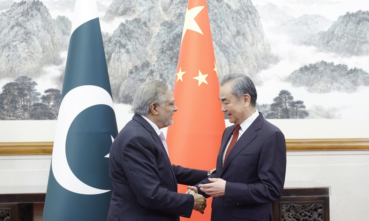 Member of the Political Bureau of the Communist Party of China Central Committee and Minister of Foreign Affairs Wang Yi (right) shakes hands with Pakistan's Deputy Prime Minister and Foreign Minister, Mohammad Ishaq Dar in Beijing on May 15, 2024. The two held the fifth round of the China-Pakistan Foreign Ministers' Strategic Dialogue that day. Photo: Website of the Chinese Foreign Ministry 
