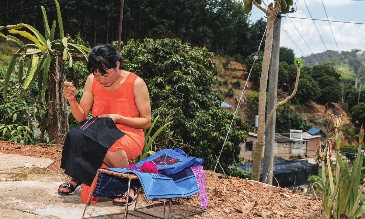 Women from Konggeliudui village embroider traditional Hani patterns on clothing in Yunnan Province, on May 13, 2024. Photo: Li Hao/GT