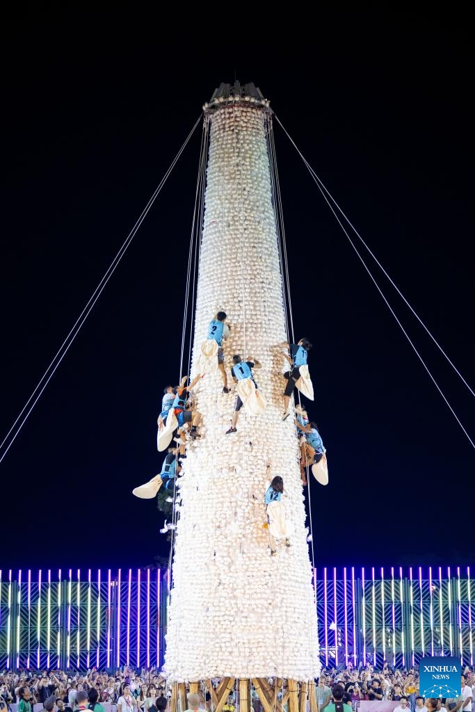 This photo taken on May 16, 2024 shows a bun scrambling competition during the Bun Festival in Cheung Chau island, Hong Kong, south China. The Bun Festival, one of Hong Kong's most colorful cultural celebration events, has been on China's national list of intangible cultural heritage since 2011. For residents of Cheung Chau, this is an important annual event. This year's Bun Festival started on May 12 and will last until May 16.(Photo: Xinhua)