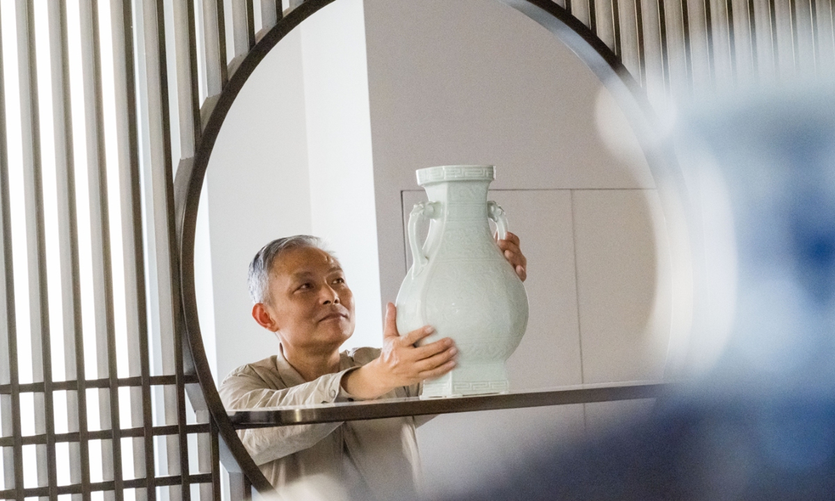 Gong Hua examines a porcelain ware in Beijing on May 13, 2024. Photo: Chen Tao/GT
