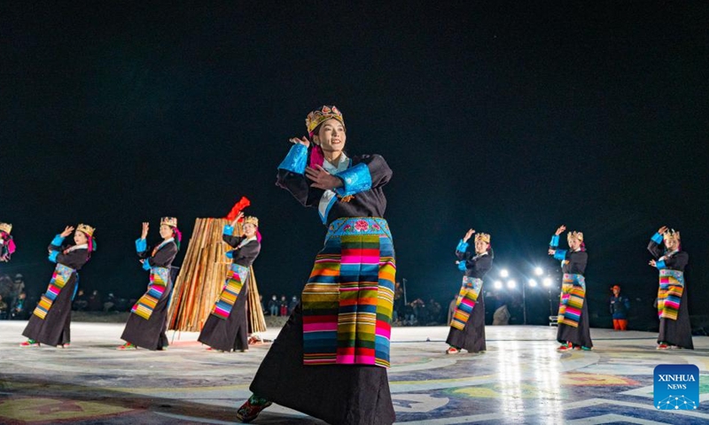 Performers dance at a bonfire party celebrating the melting of frozen water of Lake Namtso in southwest China's Xizang Autonomous Region, May 18, 2024. As temperature rises and ice melts, the Lake Namtso will enter its tourism season. Photo: Xinhua