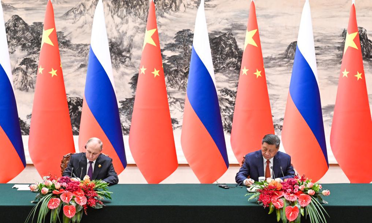 Chinese President Xi Jinping and Russian President Vladimir Putin sign and issue a joint statement on deepening China-Russia comprehensive strategic partnership of coordination for a new era on the occasion of the 75th anniversary of the establishment of diplomatic ties between the two countries after their talks in Beijing, capital of China, May 16, 2024. Xi held talks with Putin, who is in China on a state visit, at the Great Hall of the People in Beijing on Thursday.Photo: Xinhua
