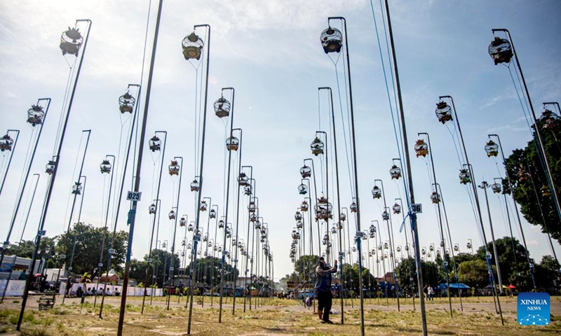 A man prepares for a turtledove chirping contest in Yogyakarta, Indonesia, May 19, 2024. Photo: Xinhua