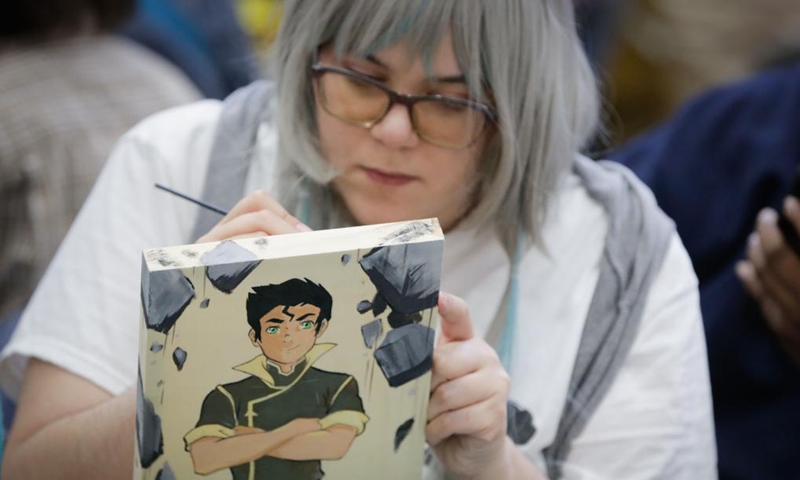 A comic artist works on her comic art during the 2024 Vancouver Comic Art Festival in Vancouver, British Columbia, Canada, on May 19, 2024. The Vancouver Comic Art Festival, an annual celebration of comics and graphic novels and their creators, including an exhibition and vendor fair, features over one hundred of comic creators from around the world this year. Photo: Xinhua