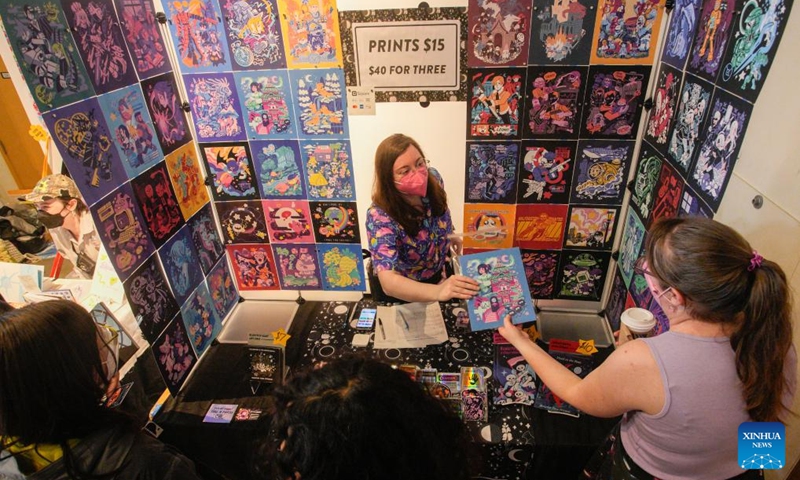People visit an exhibitor's booth during the 2024 Vancouver Comic Art Festival in Vancouver, British Columbia, Canada, on May 19, 2024. The Vancouver Comic Art Festival, an annual celebration of comics and graphic novels and their creators, including an exhibition and vendor fair, features over one hundred of comic creators from around the world this year. Photo: Xinhua