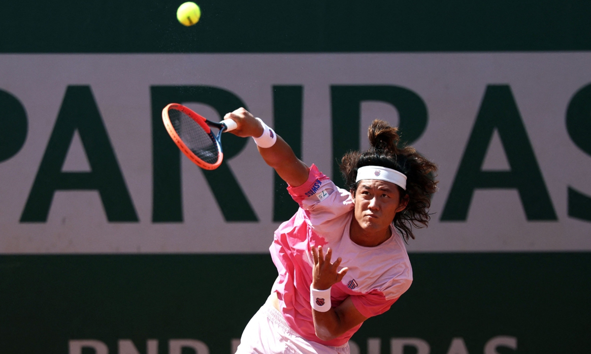 Chinese tennis player Zhang Zhizhen serves to Australia's Aleksandar Vukic during their men's singles match on Day 1 of the French Open in Paris, France, on May 26, 2024. After winning 6-4, 4-6, 6-3, 7-5, Zhang will face Italian Lorenzo Sonego in the second round. Photo: VCG