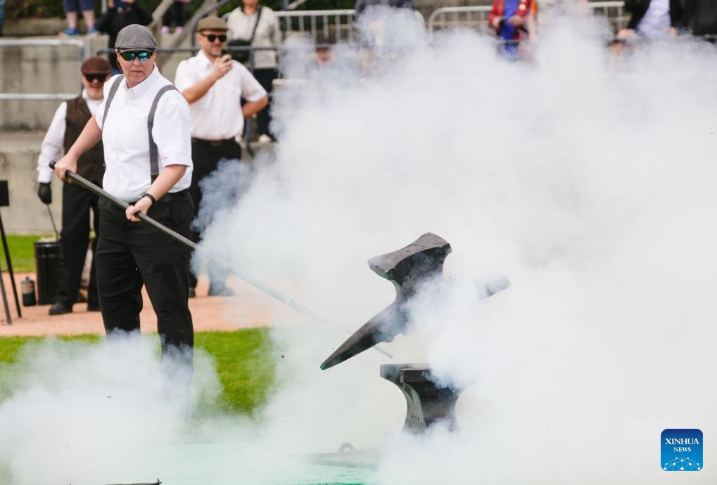 A member of the Ancient and Honourable Hyack Anvil Battery fires one of 21 salutes during the Victoria Day Anvil Battery Salute at Queen's Park Stadium in New Westminster, British Columbia, Canada, on May 20, 2024. Anvil salute is an annual tradition in the city of New Westminster dating back to the 1860s on Victoria Day.(Photo: Xinhua)