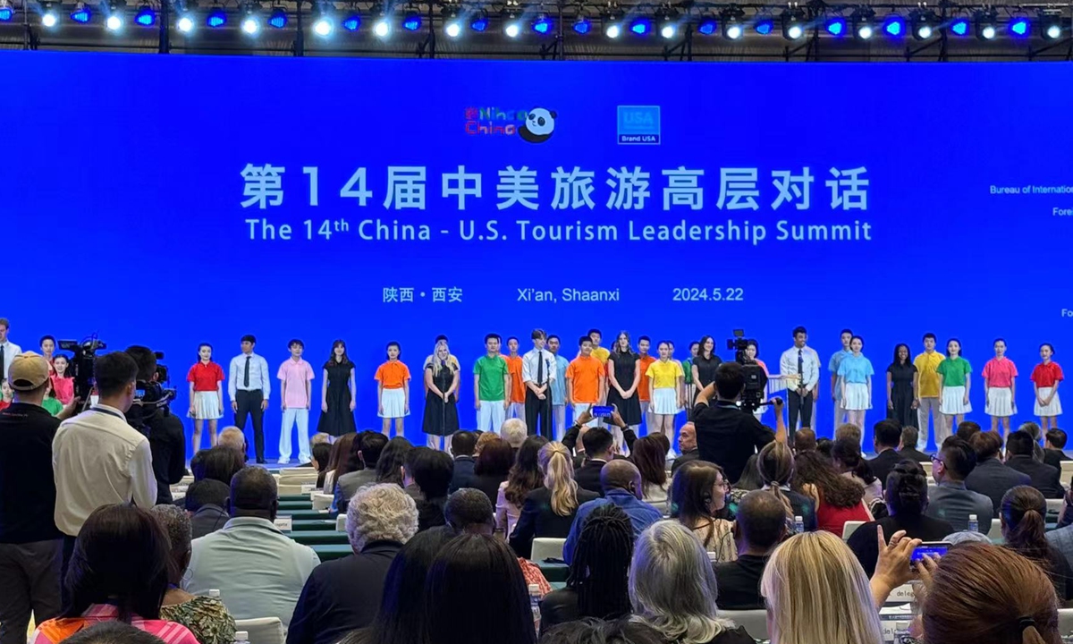 Students from Brigham?Young?University in the US and youths of China's Xi'an city choir China's folk song Jasmine at the opening ceremony of the 14th China-US Tourism Leadership Summit. Photo：Xu liuliu/GT