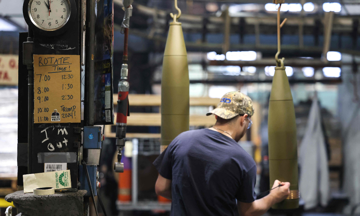 A worker handles 155 millimeter caliber shells post-manufacturing, preparing them for shipment at the packaging area of the Scranton Army Ammunition Plant in Scranton, Pennsylvania on April 16, 2024. Many of the shells used by the Ukrainian army in the conflict with Russian forces are made in the plant. Photo: VCG