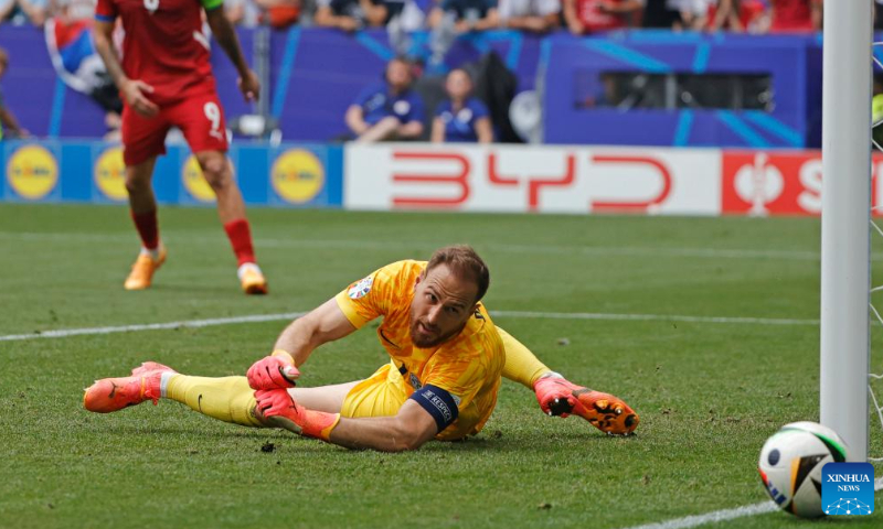 Goalkeeper of Slovenia Jan Oblak makes a save during the UEFA Euro 2024 Group C match between Slovenia and Serbia in Munich, Germany on June 20, 2024. Photo: Philippe Ruiz/Xinhua