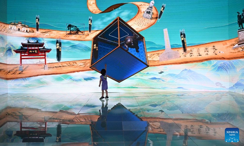 A child visits a 3D exhibition area during the 20th China (Shenzhen) International Cultural Industries Fair (ICIF) in Shenzhen, south China's Guangdong Province, May 24, 2024. The 20th ICIF opened on Thursday in the southern Chinese metropolis of Shenzhen. The fair will showcase new business forms and new applications through the combination of multimedia such as AI and AR.  (Photo: Xinhua)