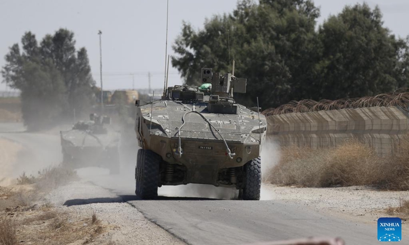 Israeli troops are seen near the border with Gaza Strip, in southern Israel, on May 29, 2024. The Israeli army announced on Wednesday that it has gained full operational control of the Philadelphi Corridor, a strip of land along the border between Egypt and the southern Gaza Strip.(Photo: Xinhua)