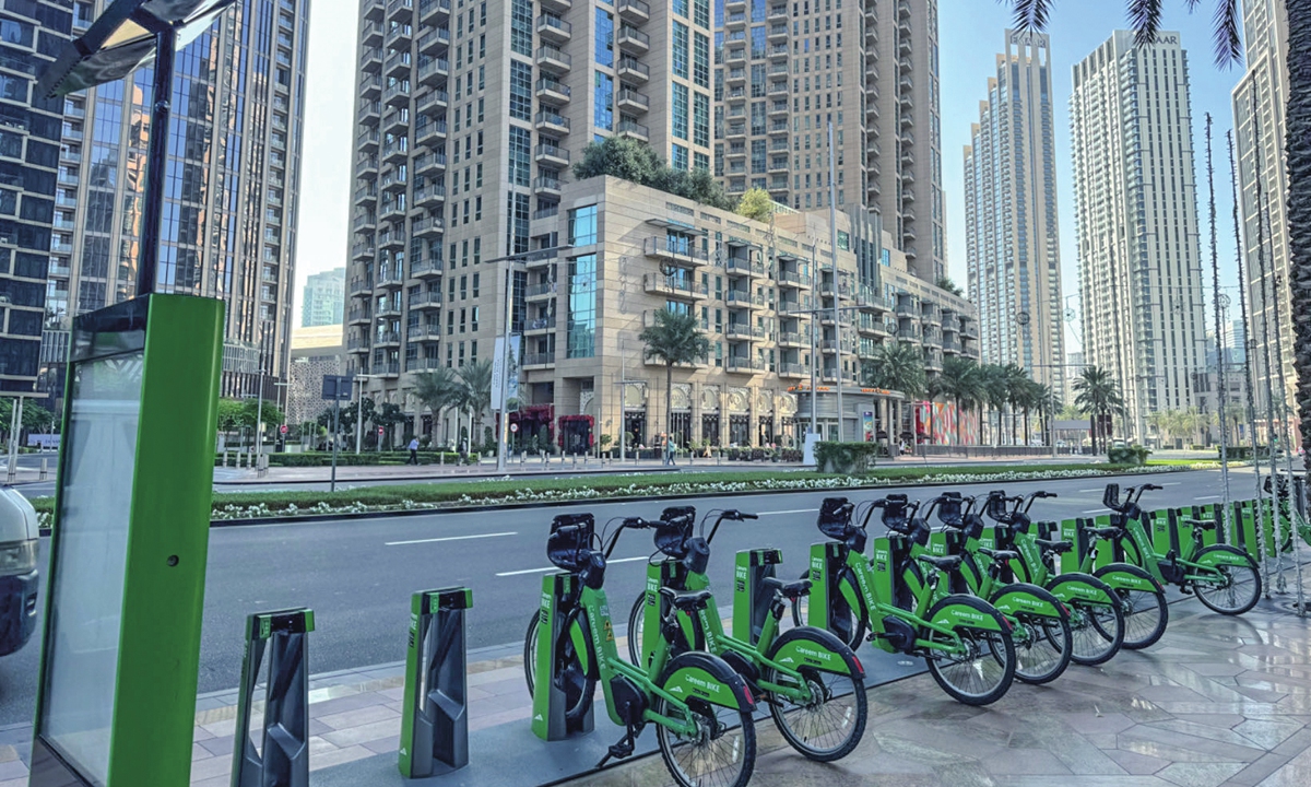 Public electric bicycles are seen parked in downtown Dubai, in December 2023. Photo: Shan Jie/GT