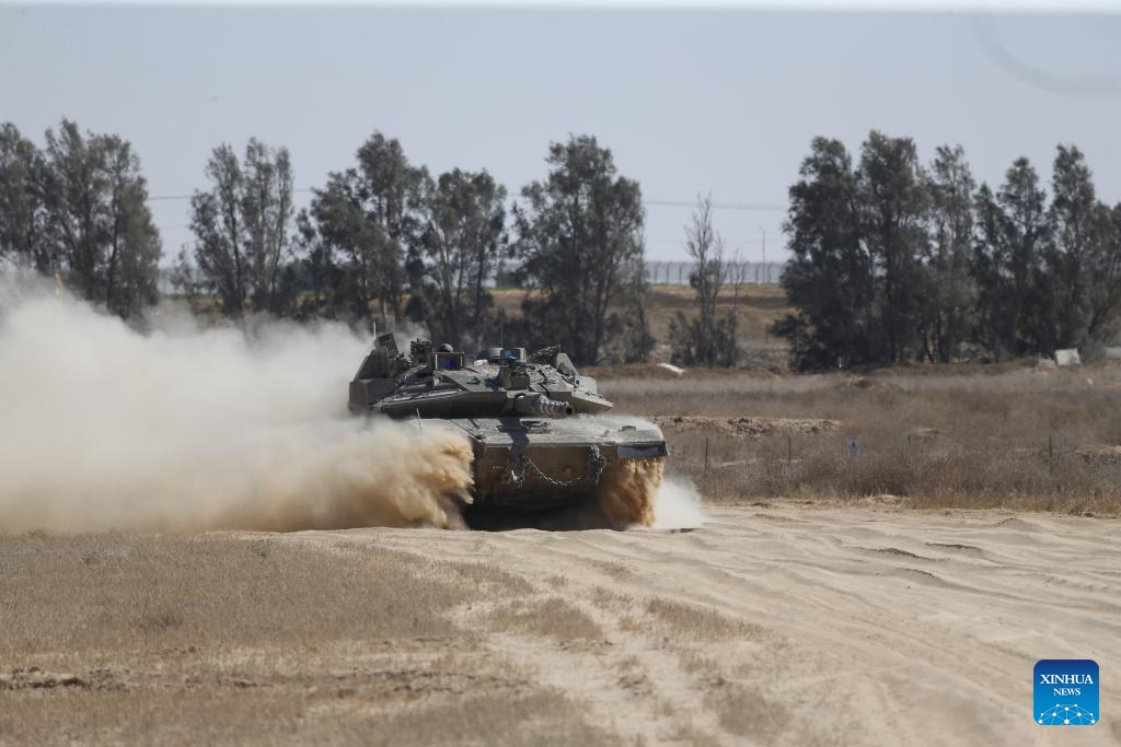 Israeli troops are seen near the border with Gaza Strip, in southern Israel, on May 29, 2024. The Israeli army announced on Wednesday that it has gained full operational control of the Philadelphi Corridor, a strip of land along the border between Egypt and the southern Gaza Strip.(Photo: Xinhua)