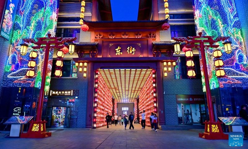 People visit a night market in Emin County, Tacheng Prefecture, northwest China's Xinjiang Uygur Autonomous Region, May 29, 2024. Xinjiang in northwest China has entered its peak tourism season recently. Emin County, located near the China-Kazakhstan border, is a popular tourist destination which provides various rural tour routes and cultural events. (Photo: Xinhua)