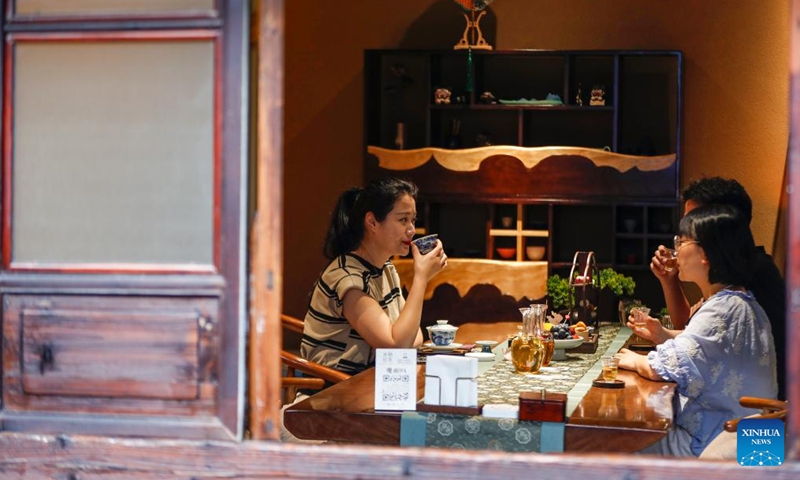 Customers drink tea beverages at a shop in Huangshan City, east China's Anhui Province, May 23, 2024. (Photo: Xinhua)