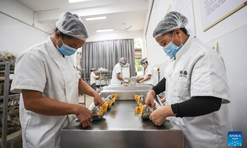 Workers pack Zongzi at a food company in Ding'an County, south China's Hainan Province, June 2, 2024. (Photo: Xinhua)