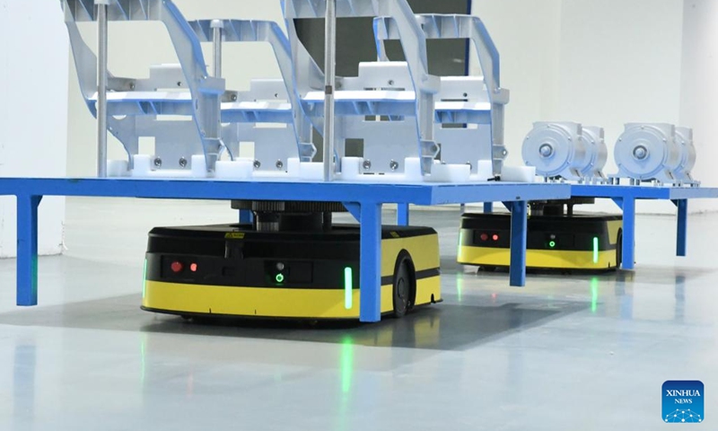Automated robots transport components at a workshop of Horwin in Changzhou, east China's Jiangsu Province, June 1, 2024. Founded in 2016, Horwin is a pioneering manufacturer of intelligent electric motorcycles, primarily targeting the overseas market. Boasting over 200 core technology patents, Horwin's electric motorcycles are sold in more than 100 countries and regions. (Photo: Xinhua)