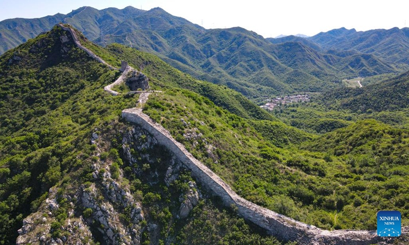 An aerial drone photo taken on June 1, 2024 shows the Great Wall and the Shixia Village in Yanqing District of Beijing, capital of China. Shixia Village in Yanqing District of Beijing was first built in the Ming Dynasty (1368-1644) and was once an important pass in the north of Juyongguan section of the Great Wall. (Photo: Xinhua)