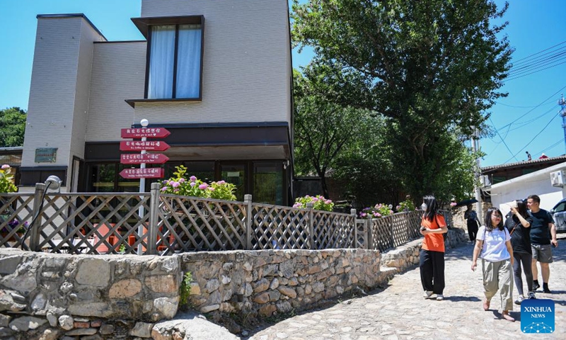 People visit Shixia Village in Yanqing District of Beijing, capital of China, June 1, 2024. Shixia Village in Yanqing District of Beijing was first built in the Ming Dynasty (1368-1644) and was once an important pass in the north of Juyongguan section of the Great Wall. (Photo: Xinhua)