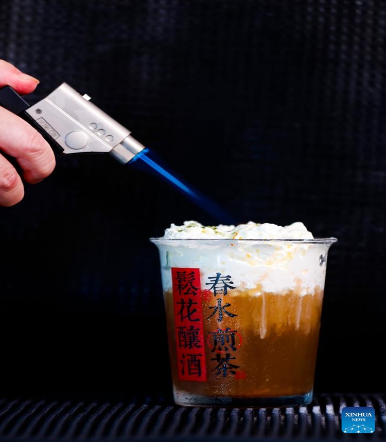 Wang Sun makes a tea beverage at Demingshe, a tea art vocational training school in Huangshan City, east China's Anhui Province, May 23, 2024. (Photo: Xinhua)