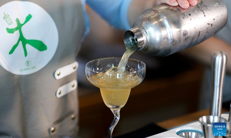 Wang Sun makes a tea beverage at Demingshe, a tea art vocational training school in Huangshan City, east China's Anhui Province, May 23, 2024. (Photo: Xinhua)