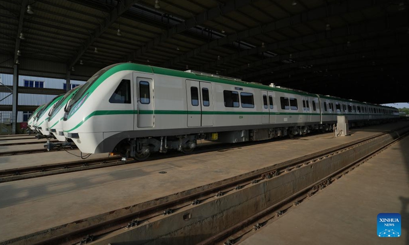 Chinese-made electric multiple unit (EMU) trains are seen at a depot in Abuja, Nigeria, on May 28, 2024. Since its relaunch for commercial operation about a week ago, talks about the Abuja Rail Mass Transit (ARMT) have been making the rounds, with local media abuzz with the prospect of the light rail system in the fast-developing Nigerian capital city.(Photo: Xinhua)
