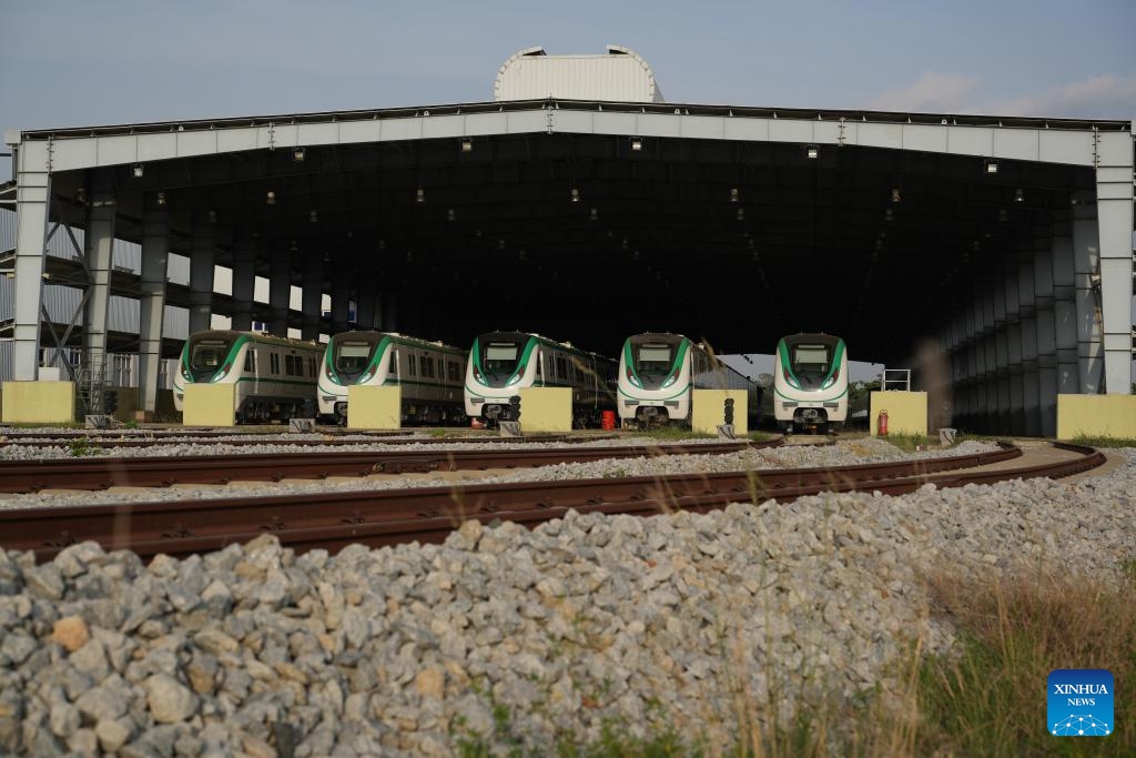 Chinese-made electric multiple unit (EMU) trains are seen at a depot in Abuja, Nigeria, on May 28, 2024. Since its relaunch for commercial operation about a week ago, talks about the Abuja Rail Mass Transit (ARMT) have been making the rounds, with local media abuzz with the prospect of the light rail system in the fast-developing Nigerian capital city.(Photo: Xinhua)