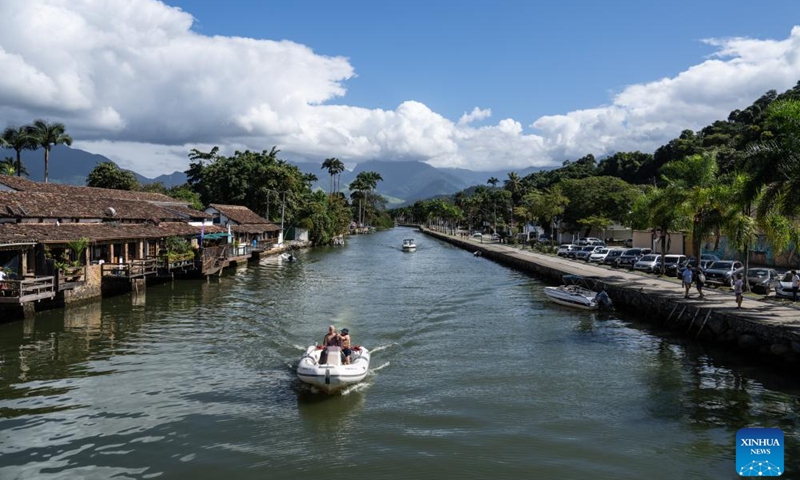 Tourists take a sightseeing boat in Paraty Historic Center in the state of Rio de Janeiro, Brazil, May 31, 2024. Paraty and Ilha Grande is a serial property comprising six component parts including Paraty Historic Center, Morro da Vila Velha, Serra da Bocaina National Park, Ilha Grande State Park, Praia do Sul Biological Reserve and Environmental Protected Area of Cairu?u.(Photo: Xinhua)