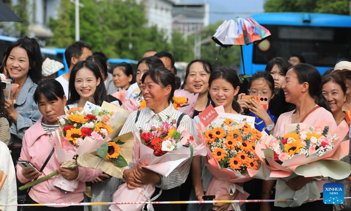 Family members of students wait outside a national college entrance examination site in Tengchong City, southwest China's Yunnan Province, June 8, 2024. China's annual national college entrance examination, also known as Gaokao, started on Friday. The exam in some regions has ended on Saturday. (Photo by Gong Zujin/Xinhua)





