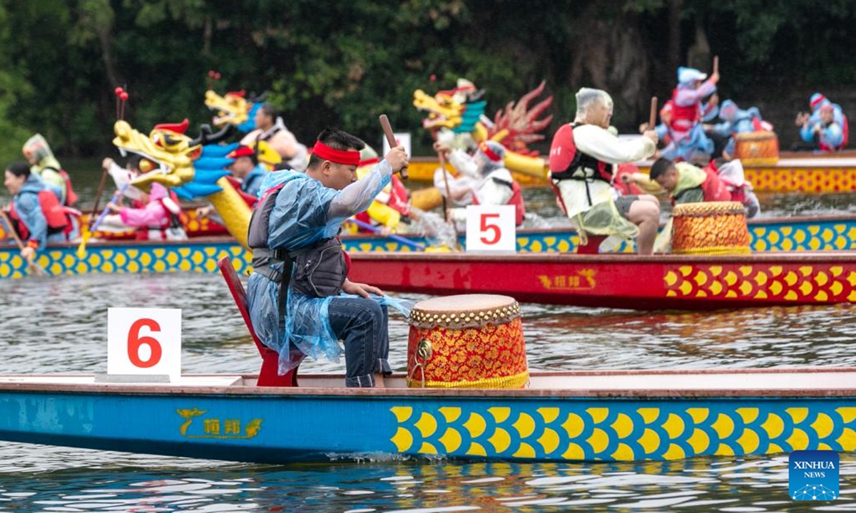 Teams compete during a dragon boat race in Lixianghu Township of southwest China's Chongqing Municipality, June 8, 2024. To celebrate the upcoming Duanwu, or the Dragon Boat Festival, dragon boat races were held in many places in China. The festival is celebrated on the fifth day of the fifth month on the Chinese lunar calendar to commemorate ancient Chinese poet Qu Yuan from the Warring States Period (475-221 B.C.). (Photo by Luo Chuan/Xinhua)

