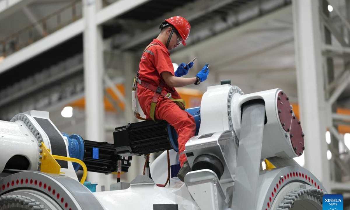 A worker works at an assembly workshop of Goldwind Co., Ltd. in Yancheng, east China's Jiangsu Province, June 5, 2024. (Xinhua/Li Ga)


