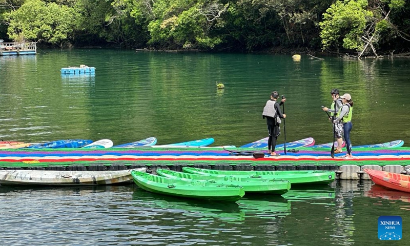 Tourists visit the scenic spot of Riyue Tan, or the Sun Moon Lake, during the holiday of the Dragon Boat Festival, also called Duanwu Festival, in Nantou County, southeast China's Taiwan, June 9, 2024. (Photo: Xinhua)