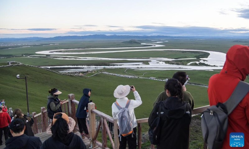 Tourists enjoy the view of the zigzag watercourse of the Yellow River in Ruoergai County of Aba Tibetan-Qiang Autonomous Prefecture, southwest China's Sichuan Province, June 8, 2024. People enjoy the 3-day holiday of the Dragon Boat Festival, also called Duanwu Festival, which falls on June 10 this year, via various activities across the country. (Photo: Xinhua)