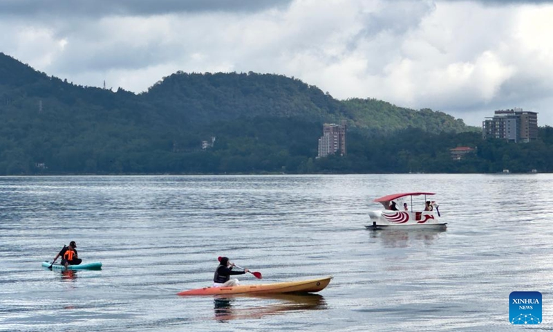 Tourists visit the scenic spot of Riyue Tan, or the Sun Moon Lake, during the holiday of the Dragon Boat Festival, also called Duanwu Festival, in Nantou County, southeast China's Taiwan, June 9, 2024. (Photo: Xinhua)