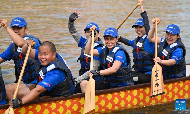 Laura Mora (3rd R), a Spanish engineer from Airbus China, and her teammate react after the final of the 2024 Haihe Dragon Boat Race in north China's Tianjin on June 10, 2024. (Photo: Xinhua)