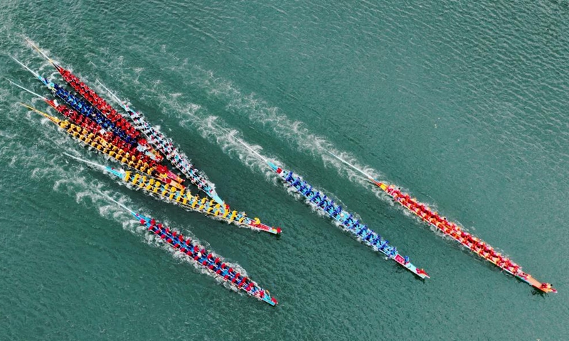 An aerial drone photo shows contestants participating in a dragon boat race at a fishing port in Lianjiang County, southeast China's Fujian Province, June 11, 2024. (Photo: Xinhua)