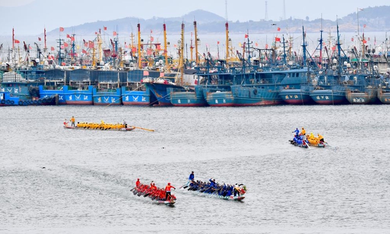 An aerial drone photo shows contestants participating in a dragon boat race at a fishing port in Lianjiang County, southeast China's Fujian Province, June 11, 2024. (Photo: Xinhua)