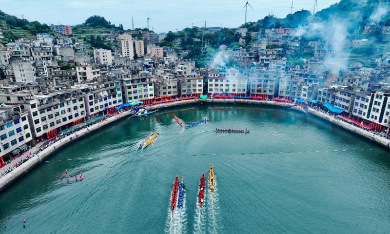 An aerial drone photo shows contestants participating in a dragon boat race at a fishing port in Lianjiang County, southeast China's Fujian Province, June 11, 2024. (Photo: Xinhua)