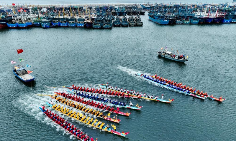 An aerial drone photo shows contestants participating in a dragon boat race at a fishing port in Lianjiang County, southeast China's Fujian Province, June 11, 2024. (Photo: Xinhua)