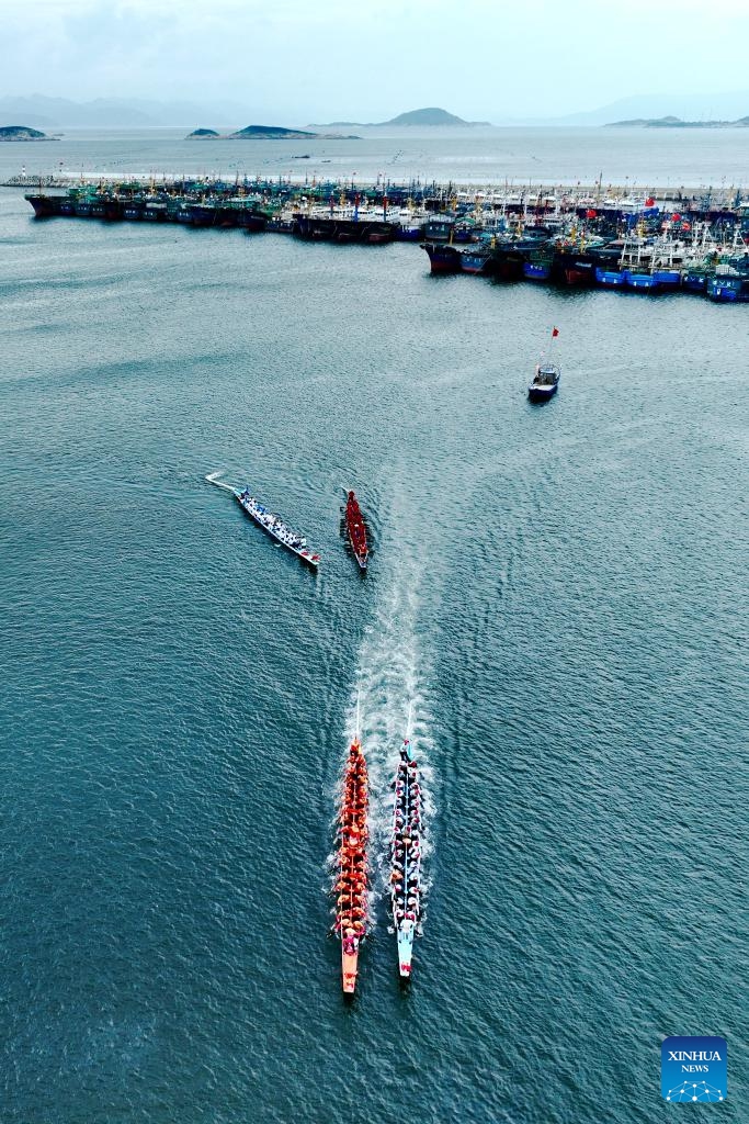 An aerial drone photo shows contestants participating in a dragon boat race at a fishing port in Lianjiang County, southeast China's Fujian Province, June 11, 2024. (Photo: Xinhua)