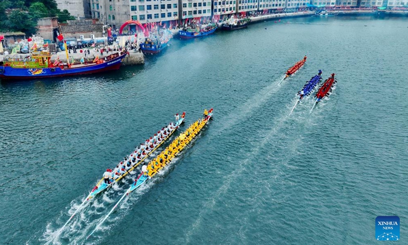 An aerial drone photo shows contestants participating in a dragon boat race at a fishing port in Lianjiang County, southeast China's Fujian Province, June 11, 2024. The dragon boat race at sea has a long history in Lianjiang. The eight-day event from the first day of the fifth month of the Chinese lunar calendar has become a well-known cultural activity to celebrate the Dragon Boat Festival, also called Duanwu Festival. (Photo: Xinhua)