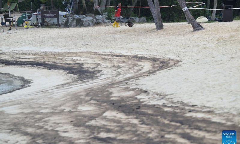 Oil stains are seen on Siloso beach of Sentosa island in Singapore, June 15, 2024. The Netherlands-flagged dredger Vox Maxima collided with Singapore-flagged bunker vessel Marine Honor at the Pasir Panjang Terminal on Friday, leading to oil leakage, said the Maritime and Port Authority of Singapore (MPA). (Xinhua/Then Chih Wey)