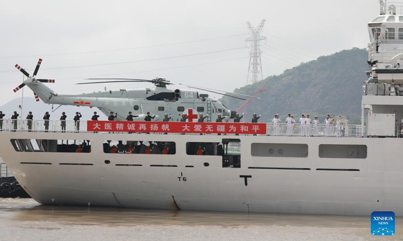 Crew members of Chinese People's Liberation Army (PLA) Navy hospital ship Peace Ark wave good-bye at a port in Zhoushan, east China's Zhejiang Province, June 16, 2024. (Photo: Xinhua)