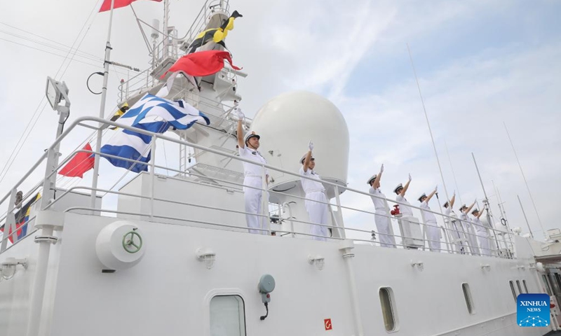 Crew members of Chinese People's Liberation Army (PLA) Navy hospital ship Peace Ark wave good-bye at a port in Zhoushan, east China's Zhejiang Province, June 16, 2024.  (Photo: Xinhua)