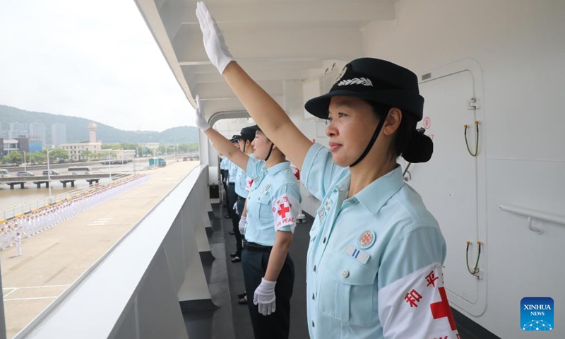 Crew members of Chinese People's Liberation Army (PLA) Navy hospital ship Peace Ark wave good-bye at a port in Zhoushan, east China's Zhejiang Province, June 16, 2024. (Photo: Xinhua)