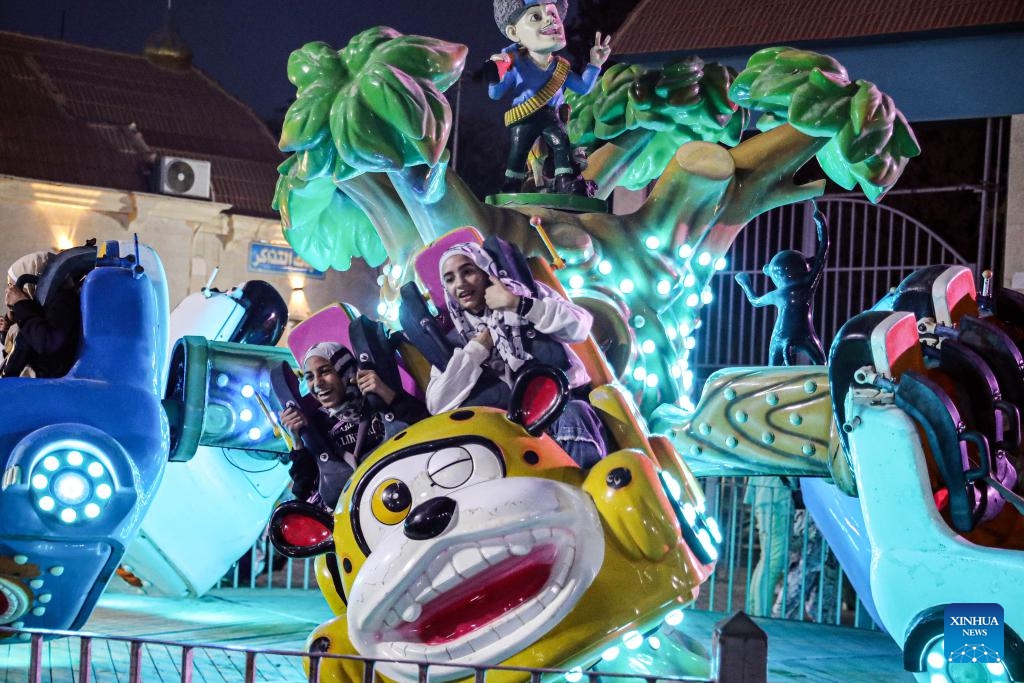 People have fun at an amusement park during the Eid al-Adha holiday in Cairo, Egypt, on June 17, 2024.(Photo: Xinhua)