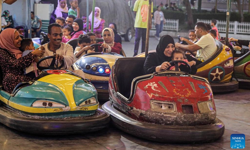 People have fun at an amusement park during the Eid al-Adha holiday in Cairo, Egypt, on June 17, 2024.(Photo: Xinhua)
