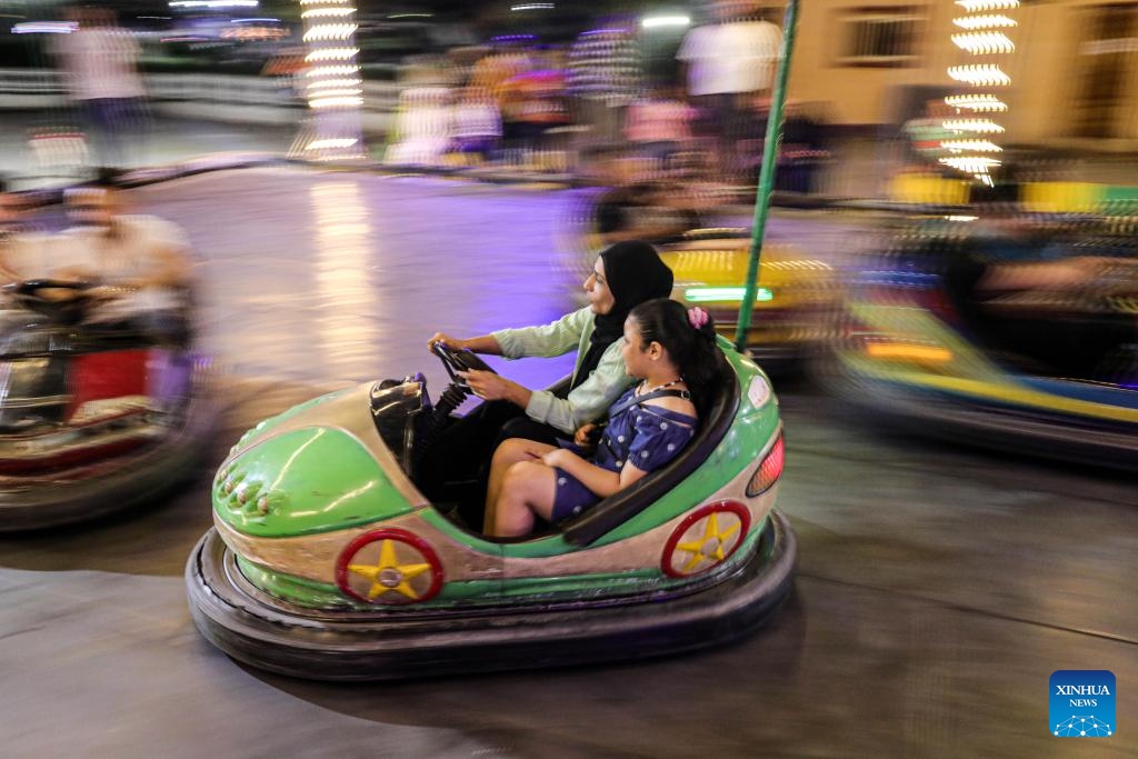 People have fun at an amusement park during the Eid al-Adha holiday in Cairo, Egypt, on June 17, 2024.(Photo: Xinhua)