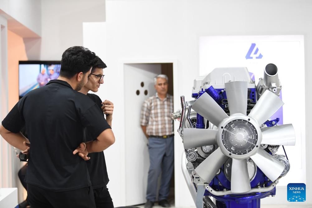 People look at a product exhibited at Iran's 19th International Auto Parts Exhibition in Tehran, Iran, June 18, 2024. The exhibition kicked off on Tuesday in Tehran.(Photo: Xinhua) 